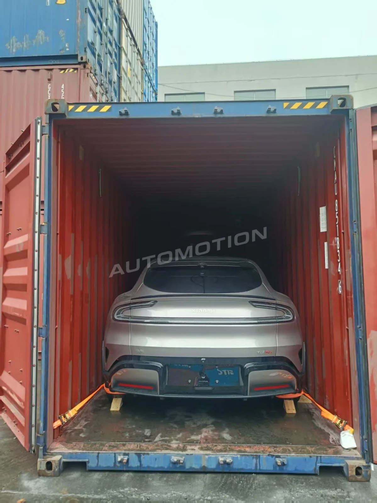 Delivery photograph 7 of 24, a vehicle loaded in a shipping container