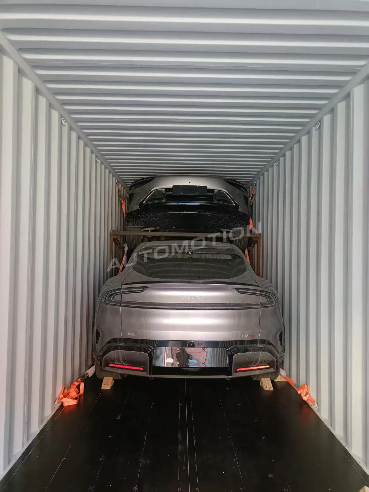 Delivery photograph 11 of 24, a vehicle loaded in a shipping container