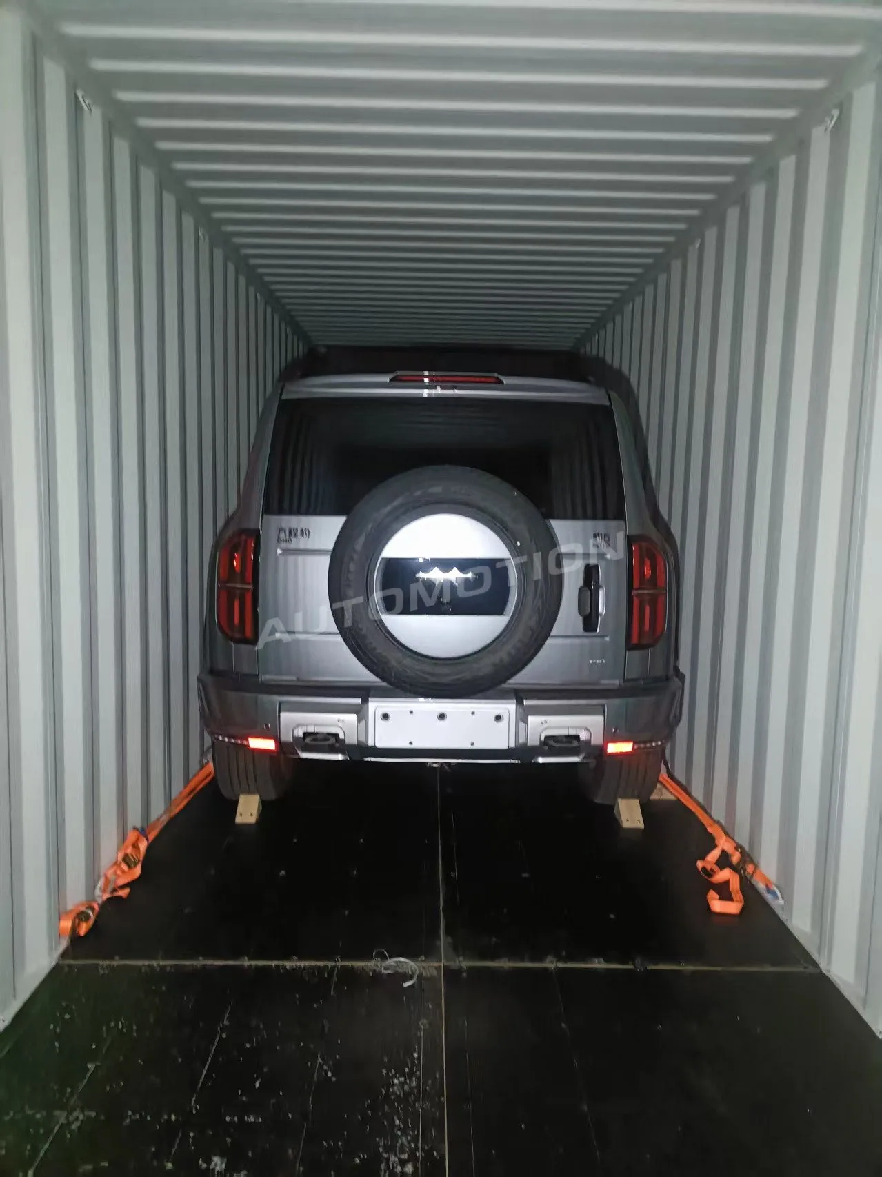 Delivery photograph 3 of 8, a vehicle loaded in a shipping container