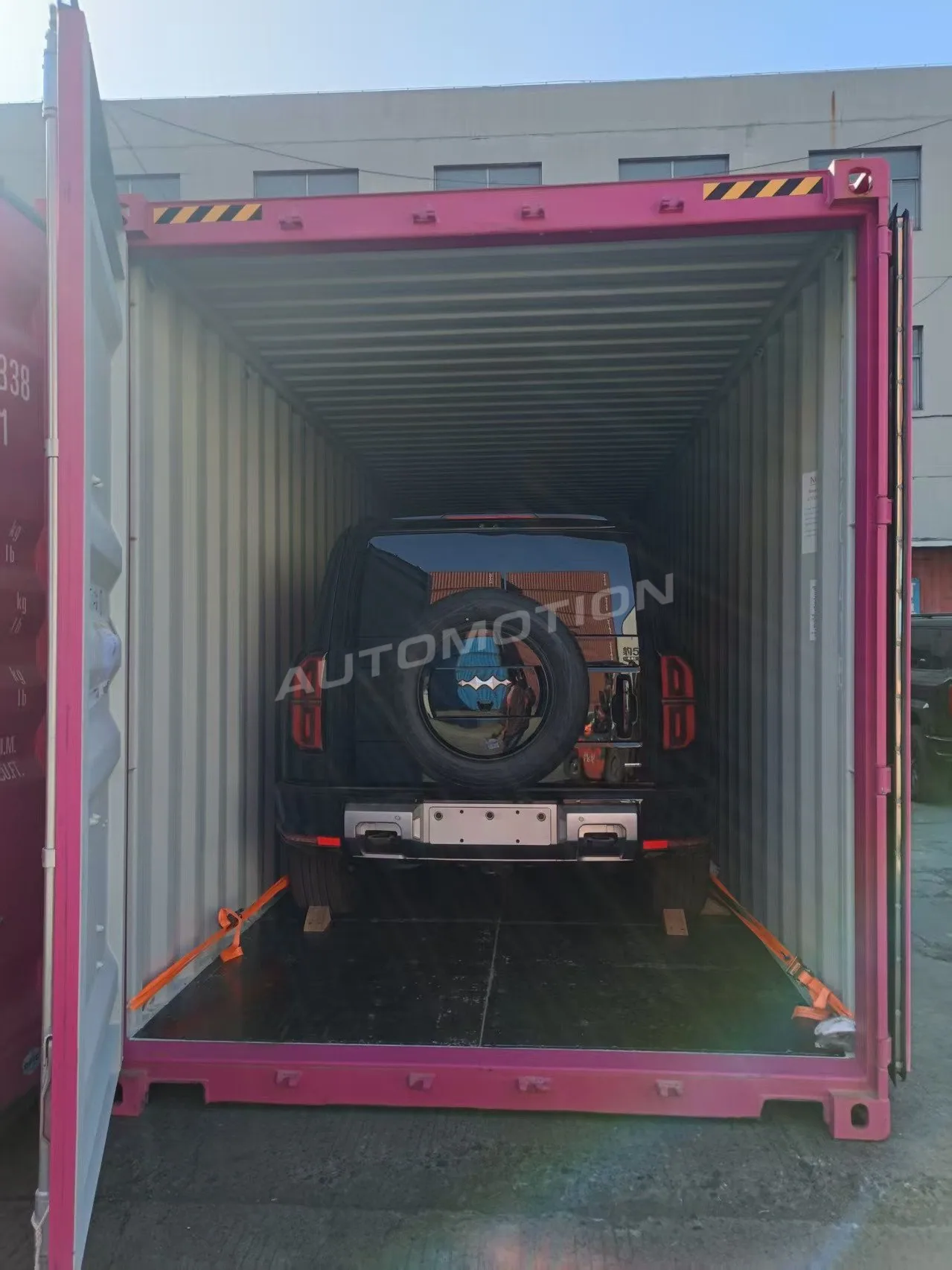 Delivery photograph 16 of 24, a vehicle loaded in a shipping container