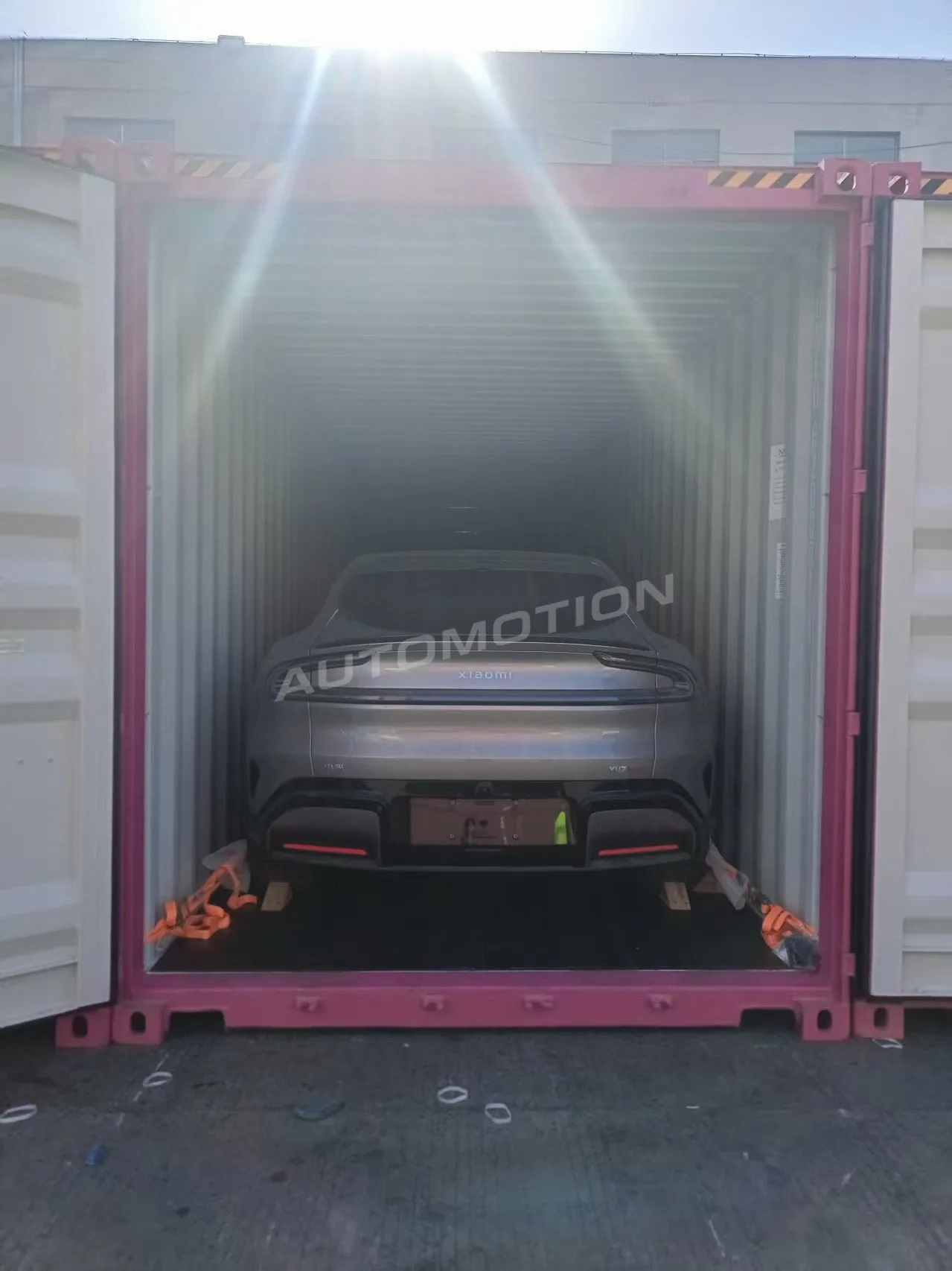 Delivery photograph 17 of 24, a vehicle loaded in a shipping container