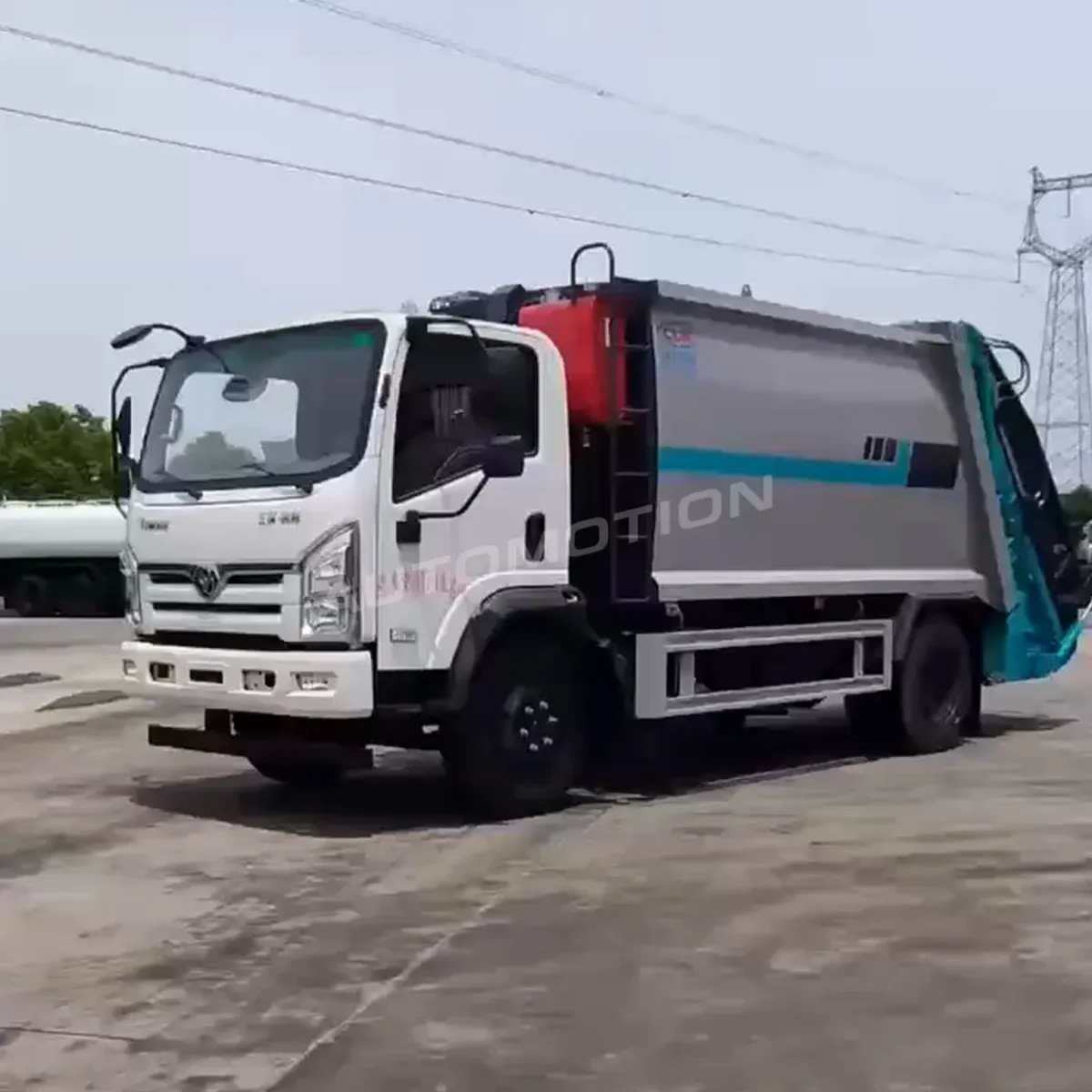 Tri-Ring 4×2 Compression Garbage Truck, listing photo 6 of 8